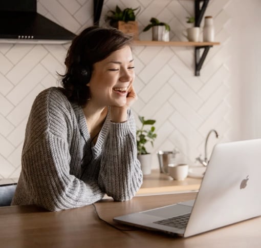 Woman taking a video call in the kitchen